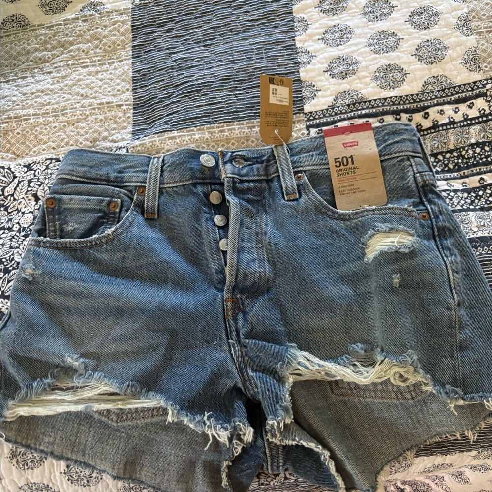 Levi's Distressed Button-Fly Denim Shorts in Mid Blue
